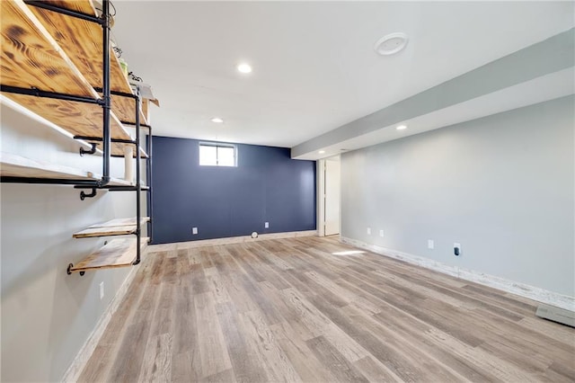 below grade area with recessed lighting, baseboards, and wood finished floors