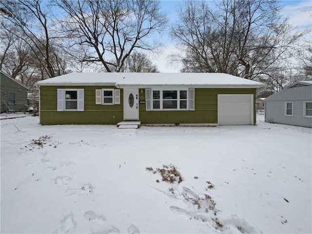 view of front of property featuring a garage and a chimney