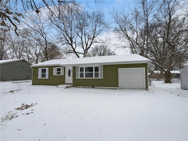 view of front of property featuring a garage