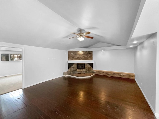 unfurnished living room featuring a ceiling fan, lofted ceiling, baseboards, and hardwood / wood-style floors