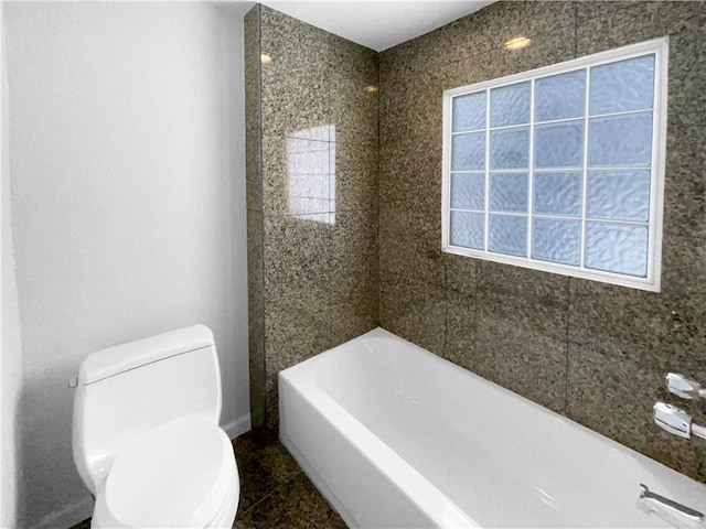 bathroom with plenty of natural light, toilet, and a bath