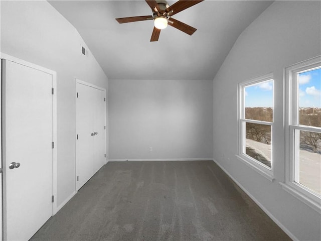 additional living space with lofted ceiling, ceiling fan, carpet, and baseboards