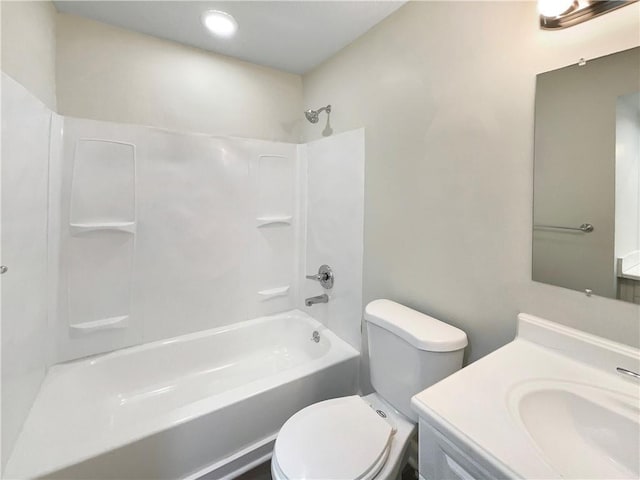 bathroom featuring toilet,  shower combination, and vanity