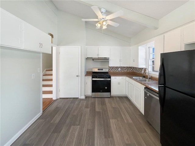 kitchen with appliances with stainless steel finishes, white cabinets, a sink, and under cabinet range hood