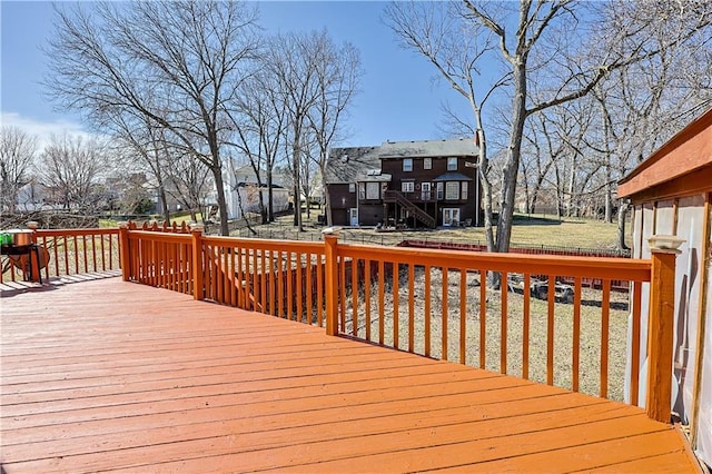 wooden terrace with a residential view