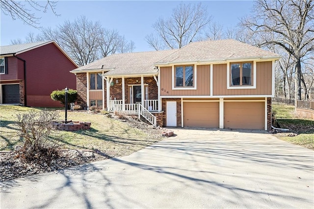 view of front of home with brick siding, an attached garage, and driveway