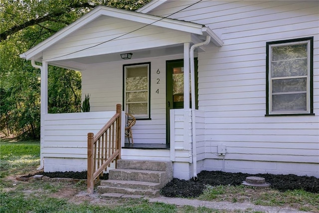 doorway to property featuring covered porch