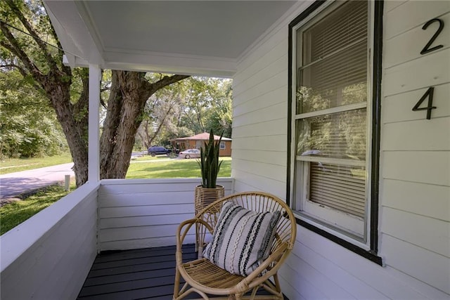 balcony featuring a porch