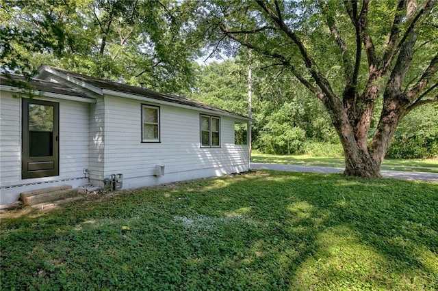 view of home's exterior featuring a lawn