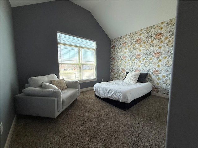 carpeted bedroom featuring wallpapered walls, lofted ceiling, and baseboards