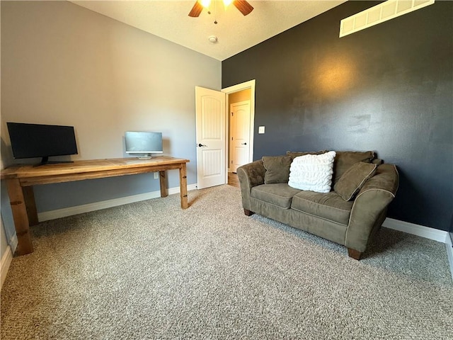 carpeted living room with vaulted ceiling, a ceiling fan, baseboards, and visible vents