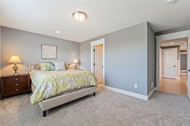 carpeted bedroom with recessed lighting and baseboards