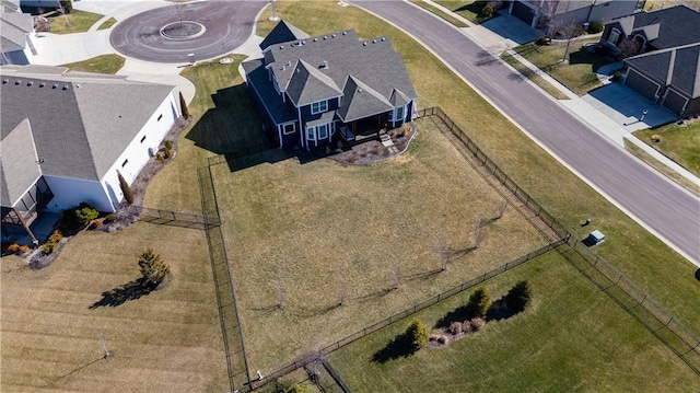 birds eye view of property with a residential view