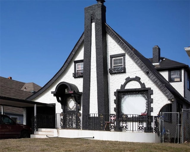 5414 E 23rd St, Kansas City, MO 64127 - exterior space featuring a gate, fence, and a chimney