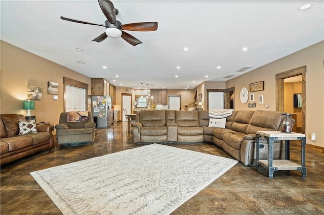 living area featuring finished concrete floors, visible vents, a ceiling fan, and recessed lighting