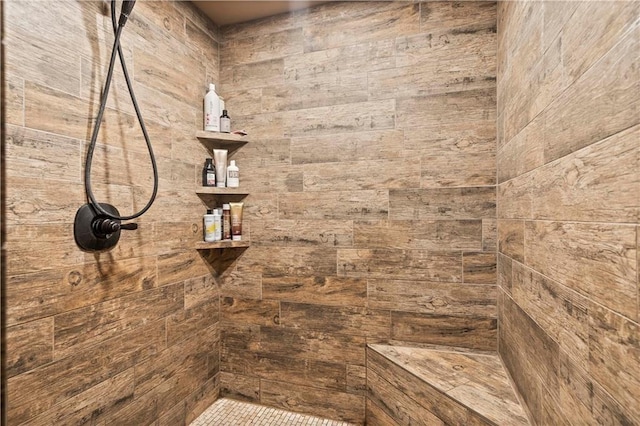 bathroom with a tile shower