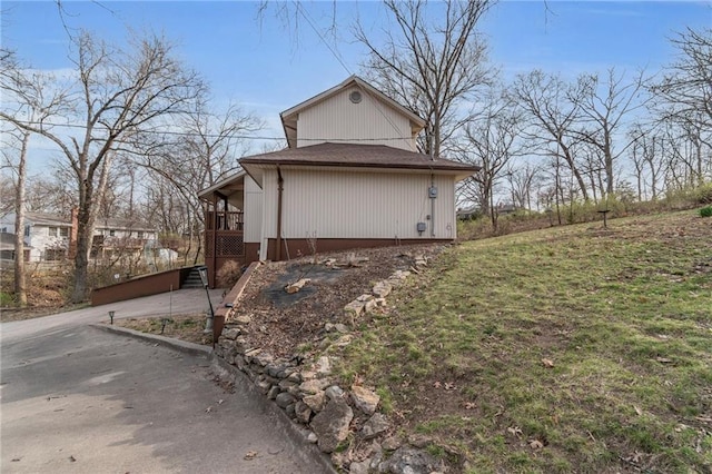 756 NW S Shore Dr, Lake Waukomis, MO 64151 - view of side of home featuring a yard