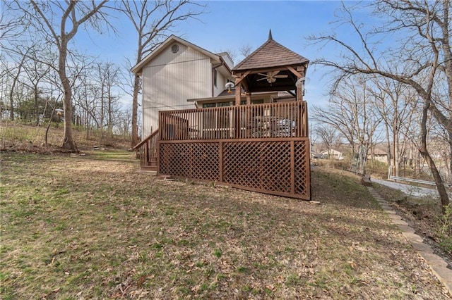 756 NW S Shore Dr, Lake Waukomis, MO 64151 - rear view of house with a wooden deck and ceiling fan