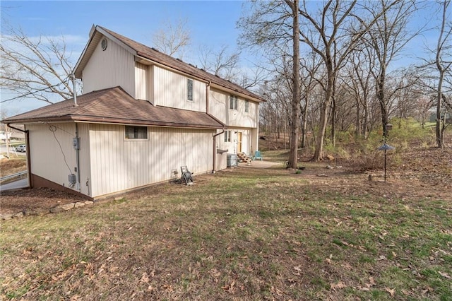 756 NW S Shore Dr, Lake Waukomis, MO 64151 - back of property featuring roof with shingles