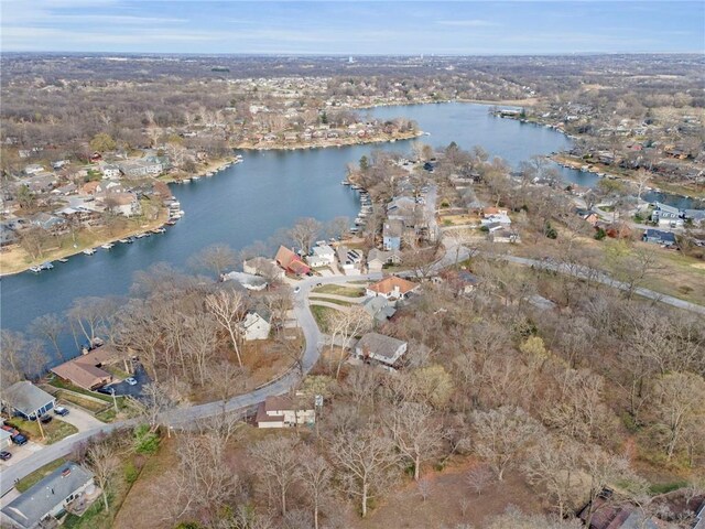 756 NW S Shore Dr, Lake Waukomis, MO 64151 - aerial overview of property's location with a large body of water and nearby suburban area