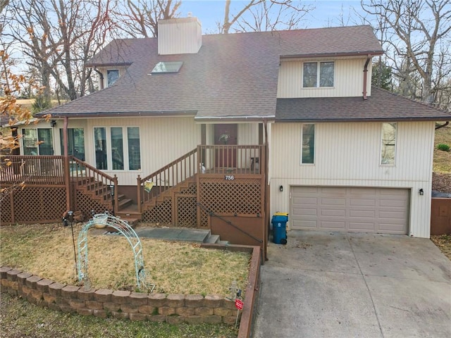 756 NW S Shore Dr, Lake Waukomis, MO 64151 - view of front of property featuring roof with shingles, a garage, concrete driveway, a chimney, and stairs