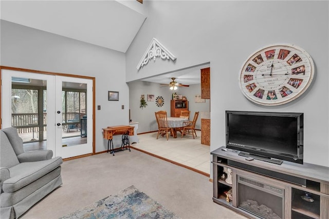 756 NW S Shore Dr, Lake Waukomis, MO 64151 - living area featuring french doors, a ceiling fan, light colored carpet, baseboards, and high vaulted ceiling