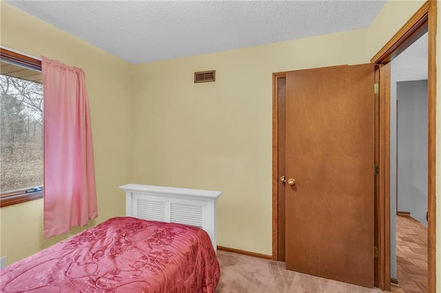 756 NW S Shore Dr, Lake Waukomis, MO 64151 - bedroom featuring a textured ceiling and carpet floors
