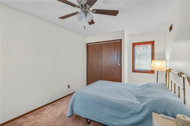 756 NW S Shore Dr, Lake Waukomis, MO 64151 - bedroom featuring carpet, a closet, a ceiling fan, and baseboards