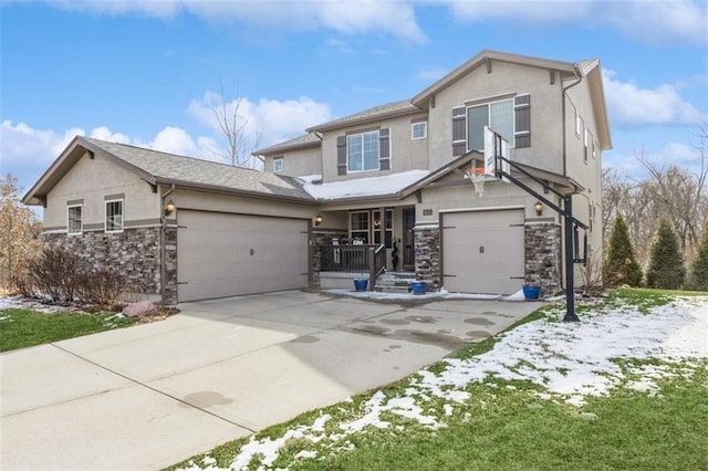 view of front of house featuring a garage, stone siding, driveway, and stucco siding