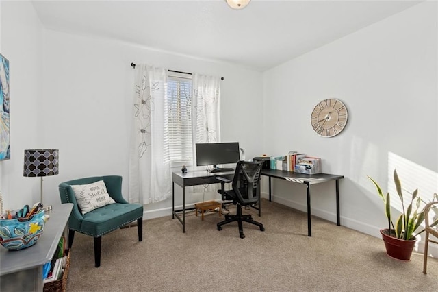 carpeted office space featuring baseboards