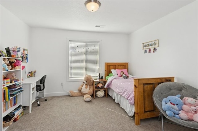 carpeted bedroom with visible vents and baseboards