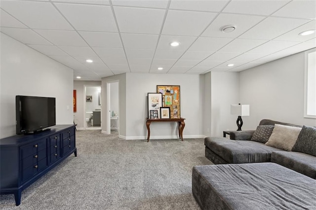 carpeted living area with recessed lighting, a paneled ceiling, and baseboards