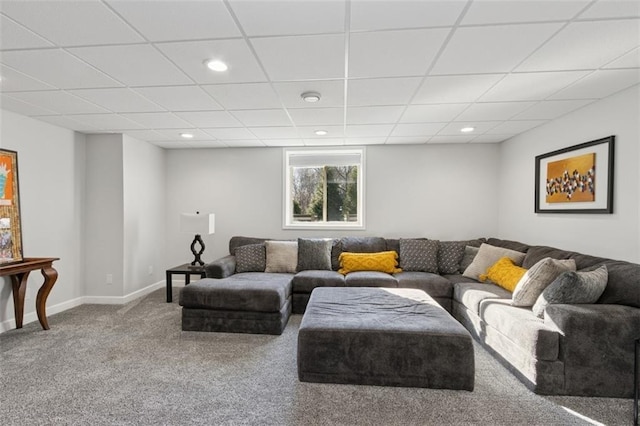 living room with recessed lighting, a paneled ceiling, baseboards, and carpet