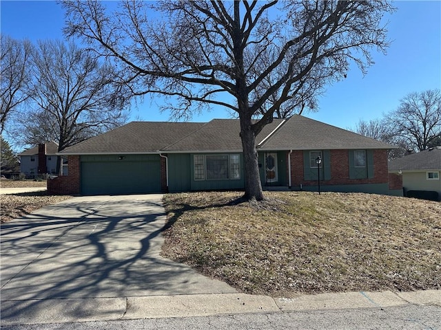 ranch-style home featuring an attached garage, driveway, and brick siding