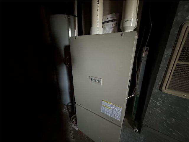 utility room with heating unit