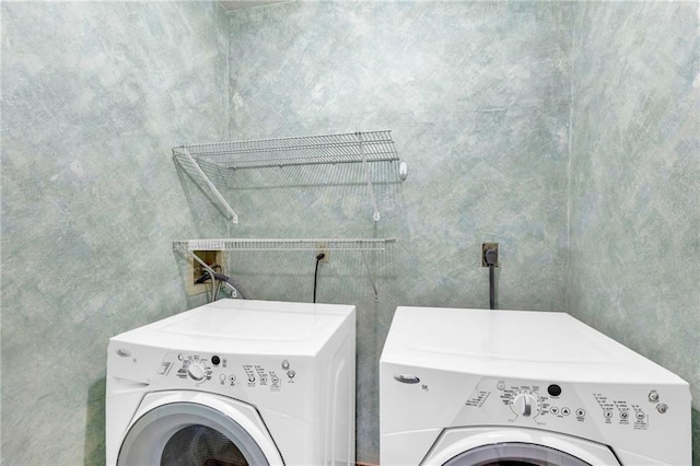 washroom featuring laundry area and washer and clothes dryer