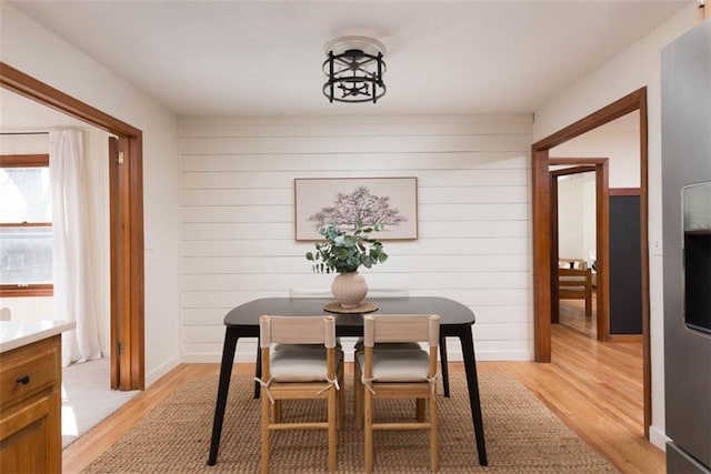 dining space with light wood-style floors