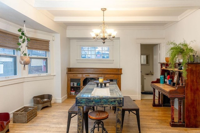 dining space with baseboards, beam ceiling, light wood-style flooring, and an inviting chandelier