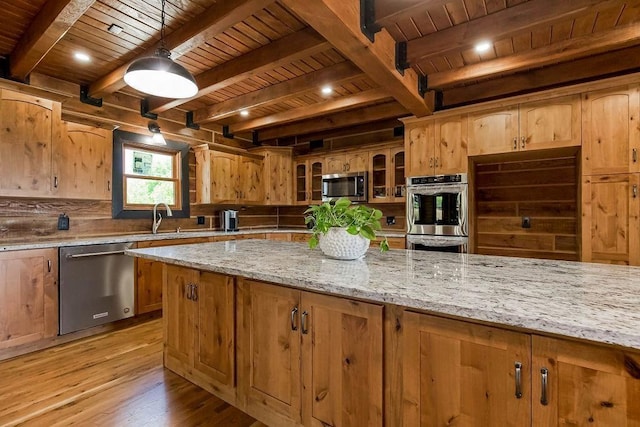 kitchen with wood ceiling, appliances with stainless steel finishes, light stone countertops, light wood-style floors, and a sink