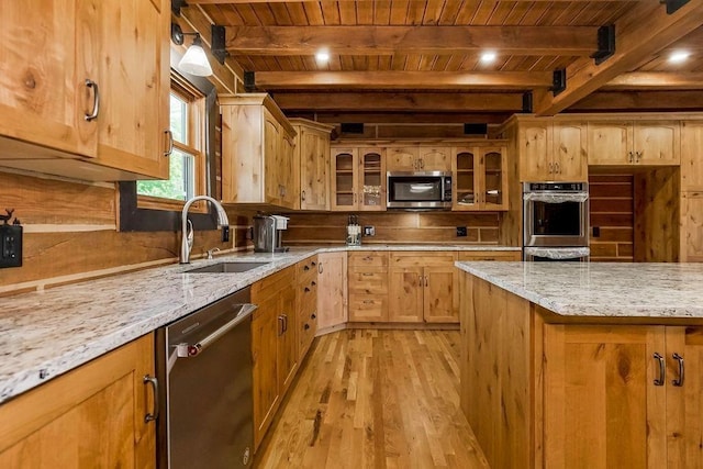 kitchen with light stone counters, stainless steel appliances, glass insert cabinets, wood ceiling, and a sink