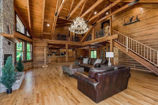 living room featuring wood walls, wooden ceiling, and wood finished floors