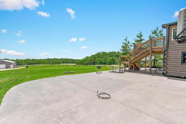 view of patio / terrace featuring a deck and stairway