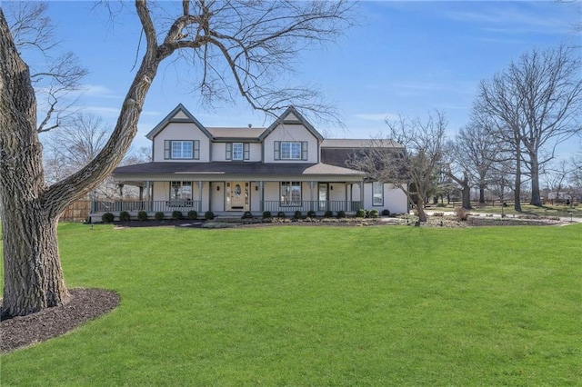 view of front facade with covered porch and a front yard