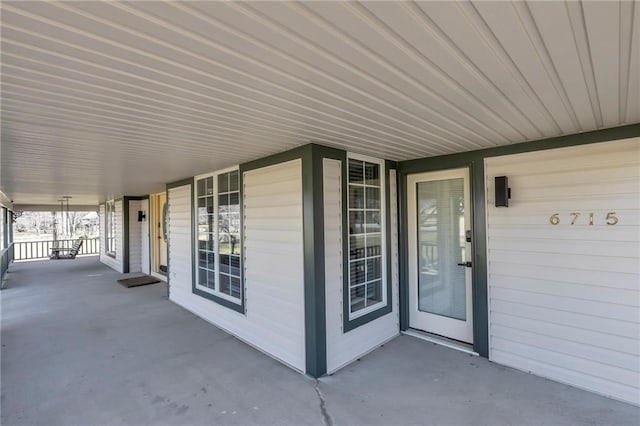 property entrance featuring covered porch