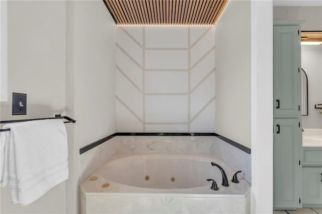 bathroom featuring vanity and a jetted tub