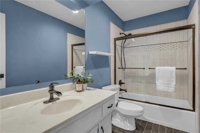 full bath with combined bath / shower with glass door, toilet, and vanity