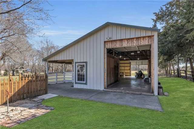 view of outbuilding with an outdoor structure and fence