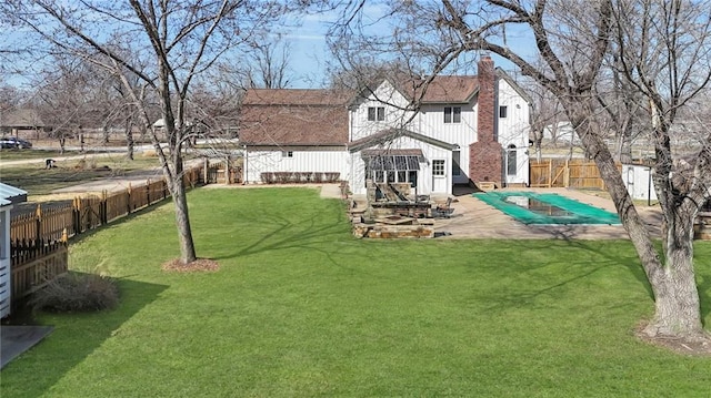 view of yard featuring a patio and a fenced backyard