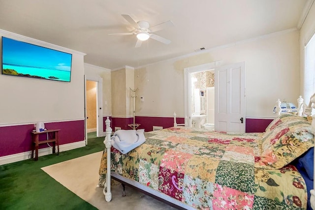 carpeted bedroom featuring baseboards, connected bathroom, visible vents, and crown molding