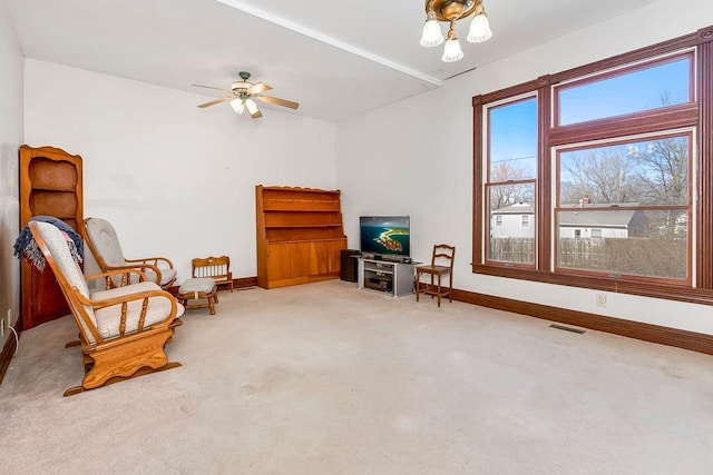 510 E Chippewa St, Paola, KS 66071 - sitting room with carpet floors and ceiling fan